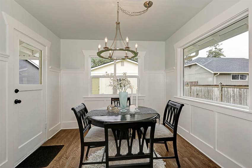 Small room with brass chandelier with candle lights